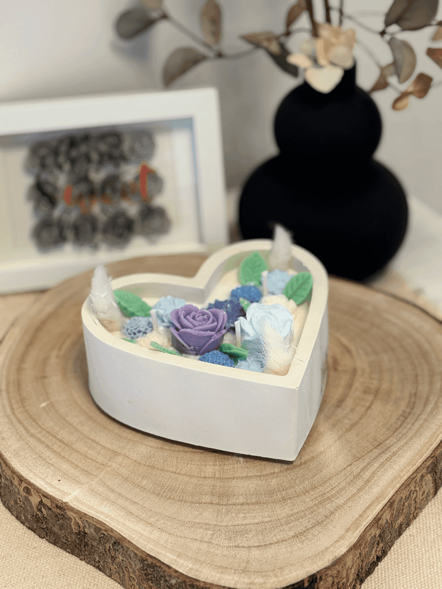 Heart-shaped candle in a plaster container Heart-shaped candle in a plaster container